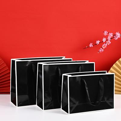 China Factory Price Recyclable Custom Printing Wedding Gift Handle Black Cardboard Paper Shopping Bag With Logo for sale