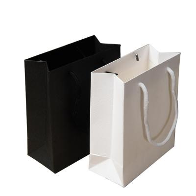 China Black Logo White PVC Cardboard Shop Gift Shopping Paper Bags Customized Free Design Customized Recyclable On A Ribbon for sale