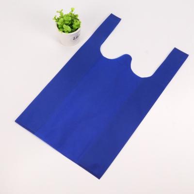 China BIODEGRADABLE Custom Image Buckle Handle Tnt Polypropylene Promotional Non Woven T-shirt Vest Bag For Shopping for sale