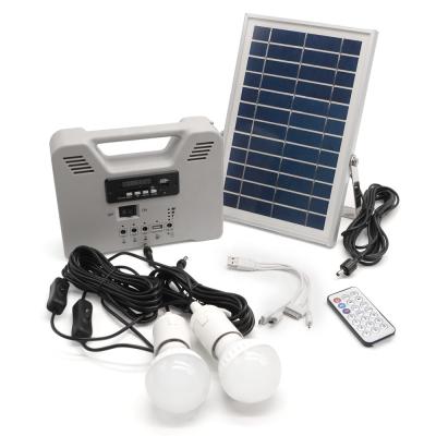 China Theme Park Multifunctional Outdoor Solar Home Lighting System Two Bulbs Solar Emergency Lamp With Radio Function FM Band Player Funtion for sale