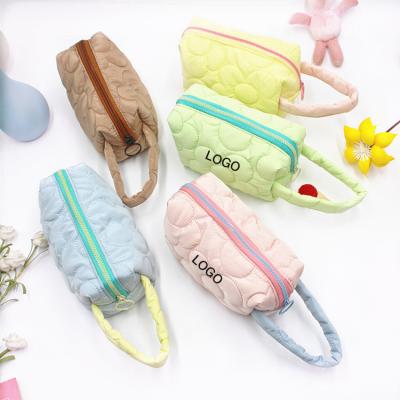 China Multi-function pen bag large capacity INS cosmetic bag waterproof shockproof dustproof women's pen bag wash and wash candy color portable storage bag single hand purse for sale