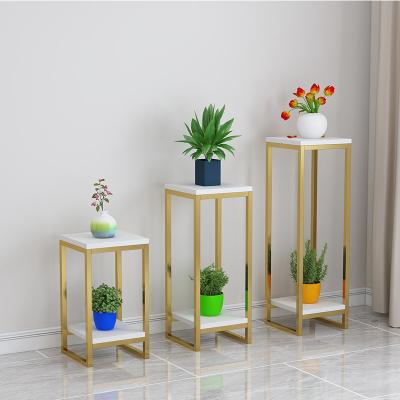 China Contemporary modern Nordic living room gold indoor flower pot, floor-to-floor storage flower rack with two small shelves is simple. for sale