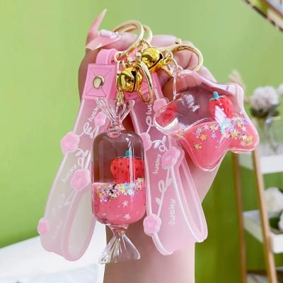 China Fashional Souvenir Gifts Oil Liquid Quicksand Strawberry Milk Teacup Sized Creative Floating Key Chain for sale