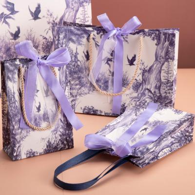 China 2021 Recycled Materials Matt Lamination Chinese Style Printing Art Paper Sack Gift Bags With Ribbon Handles for sale