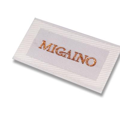 China Fashion Label Gold Sustainable High End Yarn Woven Label Patch For Women's Head Label for sale