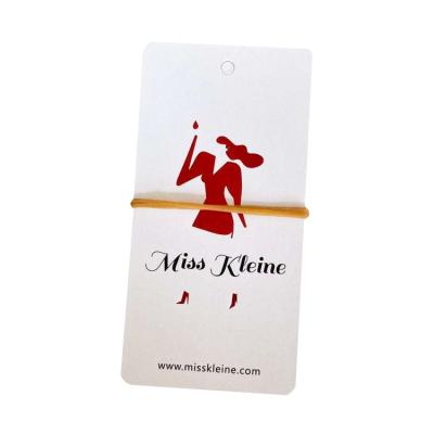 China Viable custom transparent pvc hangtag printing iron special paper red logo embossing 400G copperplate paper label for sale