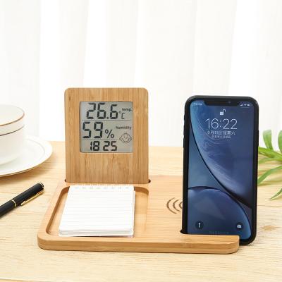 China Multifunctional Bamboo Wooden Mobile Phone Mobile Phone Wireless Charging Three-in-One Bracket Wholesale Pendulum Temperature Humidit SZ-WSDQX 05 for sale