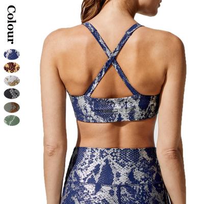 China Antibacterial Gold Bronzed Snake Pattern Sports Bra Yoga Fitness Shockproof Bra Cross Back Wear Bra For Women for sale