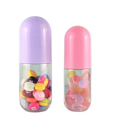 China Plastic Food PET Bottle Cap Macaron Color Pill Capsule Shaped Pink Blue Bottle For Candy for sale