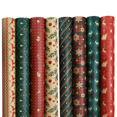 China Recyclable Candy Thickened Gift Wrapping Paper Printed Santa Christmas Gift Wrapping Paper for sale