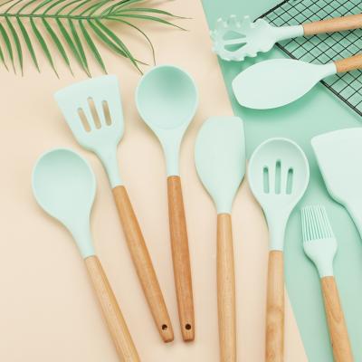 China 9 Pieces Sustainable Kitchenware Silicone Heat Resistant Utensils With Wooden Handle Cooking Utensils Set for sale