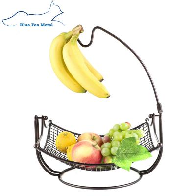 China Sustainable Household Kitchen 2 Tier Metal Wire Mesh Fruit Candy Basket With Banana Hanger for sale