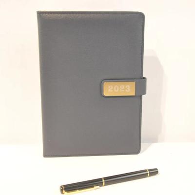 China Wholesale A5 Magnetic Faux Leather English Weekly Planner Custom Cover Daily Calendar 2023 Magnetic Diary Notebook With Pen Holder for sale