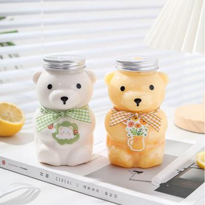 China 350 ml 400 ml 700 ml botella de jugo en forma de oso de plástico para mascotas con tapa de tornillo y correas en venta