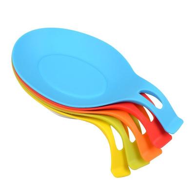 China Amazon New Sustainable Design Kitchen Silicone Spoon Rest Almond Shaped Silicone Kitchen Utensil Rest Pocket Spoon Holder for sale