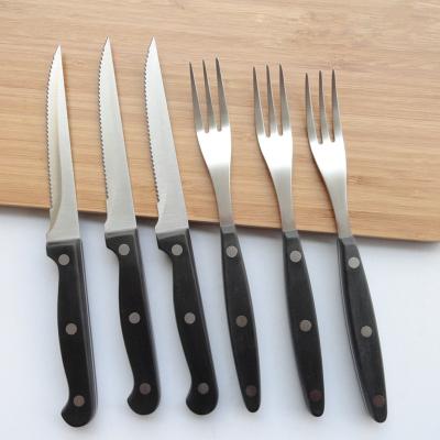 China Viable Wholesale Low Price Professional Pom Handle Triple Rivets Kitchen Knives Steak Knife Set and Fork Set For Gift for sale