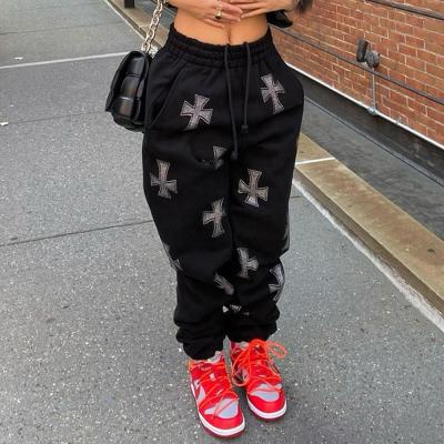 China Anti-Wrinkle Wholesale Loungwear Women Black Drawstring Track Pants Cross Print Loose Pants For Women for sale