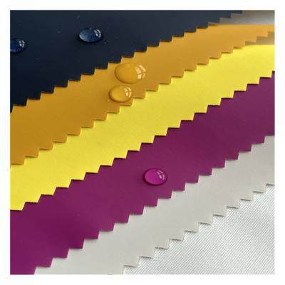 China Release Paper PU Transfer Coating Fabric Waterproof PU Coated Fabric 100%Polyester Down Jacket Raincoat Fabric for sale