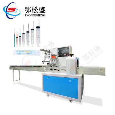 China Horizontal Automatic Food Syringe Packing Machine Injector Pillow Packaging Machine for sale