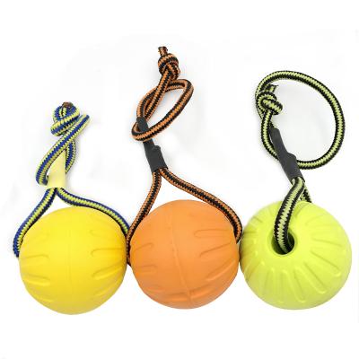 China Wholesale Viable Dog Chew Toys Pets Yellow EVA Hollow Ball Dog Toy Ball With Rope for sale