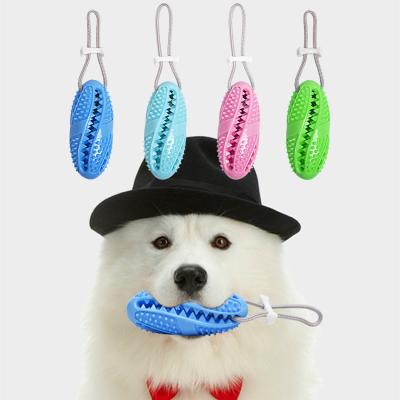 China Viable Multifunctional Pet Molar Bite And Sounding Decompression Ball Leakage Soft Rubber Toy Rugby Toy for sale