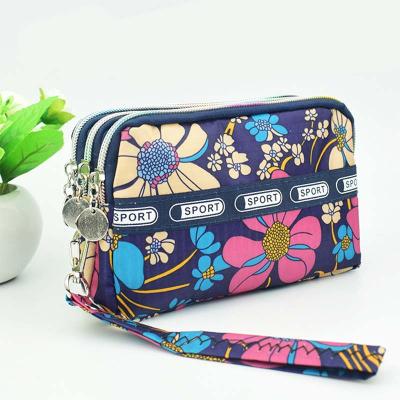 China Newest Waterproof Korean Multi Layer Flower Printing Handbag Wallet Wholesale Women's Oxford Bags Purse for sale