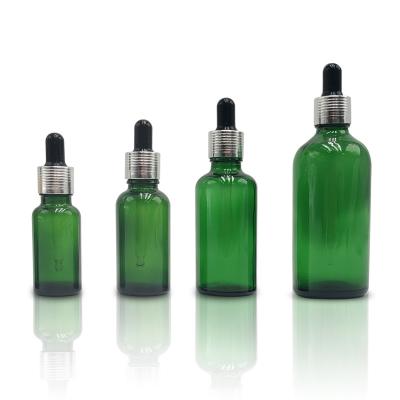 China Wholesale 5ml 10ml 15ml 20ml 30ml 50ml 100ml cosmetic luxury green essential oil eye essence dropper glass bottle with dropper and cap for sale