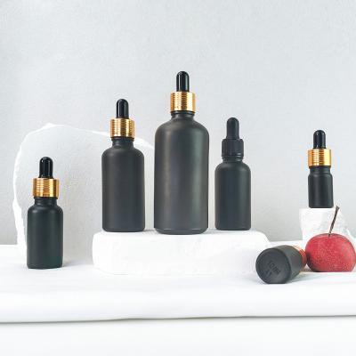 China Wholesale 5ml 10ml 15ml 20ml 30ml 50ml 100ml Matte Black Glass Essential Oil Eye Essence Cosmetic Dropper Bottle With Dropper And Cap for sale