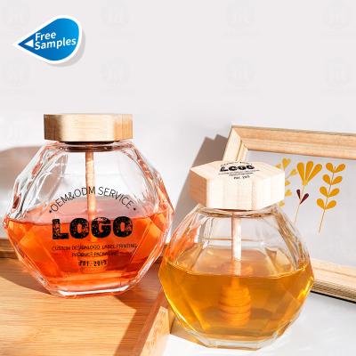 China Wholesale 250ml 500ml 1000ml High End Clear Glass Honey Jar Food Storage Jar Honey Comb Design With Cap And Wooden Dipping Stick for sale