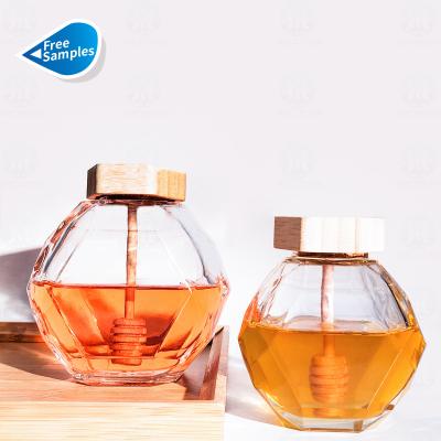 China Hot Sale 250g 500g 1000g Wooden Food Cap Stirred Stick Glass Jar Hexagon Crystal Honey Jars With Wooden Lid for sale