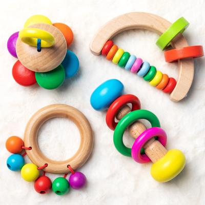 China Popular Musical Other Educational Toys Wooden Infant Toddler Grasping Rattles Wooden Dumbbell Baby Rattle 4PCS for sale