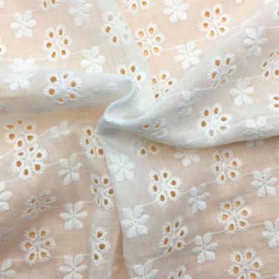 China Breathable 100% cotton embroidered cotton fabric for baby clothing schiffli lace hollow out fabric hot sale for sale