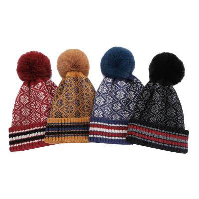 China COMMON Wholesale Bohemian Knit Beanie Hat Women Winter Pom Pom Hat Warm Plush Knitted Aztec Skull Caps for sale