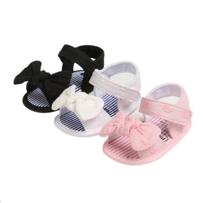 China Wholesale Solid Color Flat Single Soft Sole Bowknot Casual Walking Children's Baby Sandals for sale