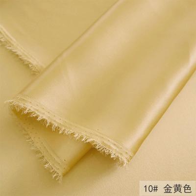 China Organic New Golden Silk Glacier Blue Embossed Bubble Texture Is Soft And Slightly Elastic Cloth Jacquard Fabric for sale