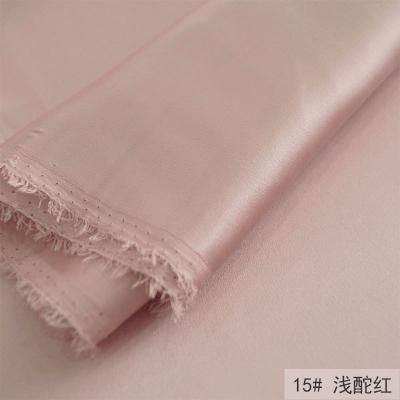 China Organic Wholesale Shiny Elastic Polyester Satin Silk Fabric For Shirt Tracksuit for sale