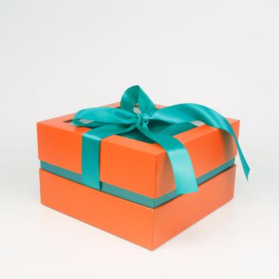 China Recyclable Christmas In Stock Beautiful Custom Cardboard Orange Paper Gift Packaging Box With Green Ribbon for sale