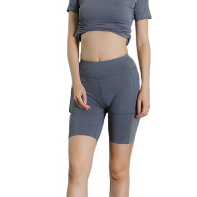 China QUICK DRY Ladies Fitness Yoga Shorts Night Running Gear Dry Tight Shorts With Side Pocket for sale