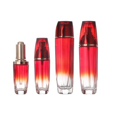 China Ruby Red Manufacturer Direct Sales 30ml 50ml Personal Care Packing Lotion Cosmetic Bottles Sets With Gold Red Glass Caps And Pumps for sale