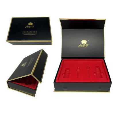 China Luxury Custom Materials Matte Black Recycled Cosmetic Magnetic Gift Box For Essence Set Bottle With Plastic Insert for sale