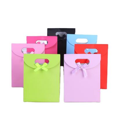 China Recyclable Custom Paper Flip Cover Sticky Wedding Gift Bag With Die Cut Handle for sale