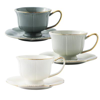 China Viable European Style Medieval Flower Shaped Coffee Tea Cup And Saucer Set Ceramic Maker Selling White for sale