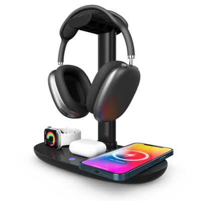 China Multifunctional Mobile Phone Headset Holder 4 in 1 Wireless Charger QI Fast Charging Desktop Wireless Charger for iPhone Series for sale