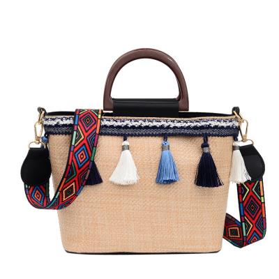 China 2020 Fashion Ethnic Style Beach Ladies Bohemia Tassels Bucket Shoulder Weaving Cross - Body Bags For Women for sale