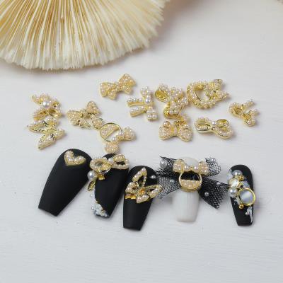 China Nail Art Missbloom Alloy Pearl Butterfly Finger Nails Charm Decoration 3D Nail Designs Art Bowknot Accessories 2022 for sale