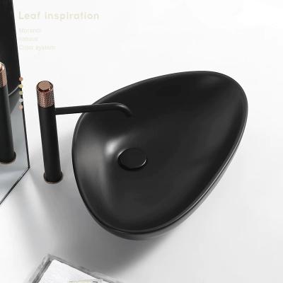 China Modern Luxury Matte Black Bathroom Sink Ceramic Hand Wash Basin for sale