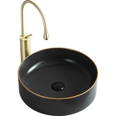 China Modern Luxury Bathroom Sink High Temperature Fired Matte Black Countertop Round Ceramic Basin With Rose Gold Line for sale