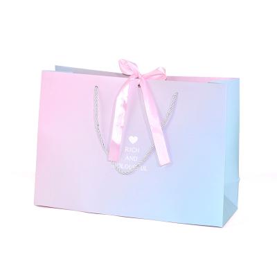 China Recycled Materials Handle Packaging Ribbon Custom Gift Bags With Ribbon Handles Paper Shopping Bag With Logo for sale