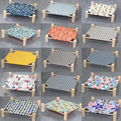 China 2022 New Design Pet Bed Summer Cooling Outdoor Travel Pet Cradle Comfortable Washable Wooden Canvas Pet Bed for sale