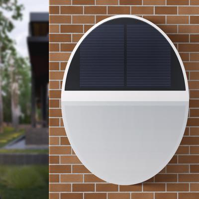 China Outdoor Waterproof IP65 Garden Plant Wall Lamp Motion Sensor Solar Activated Wall Light Outside Led Solar Street Light 2022 for sale